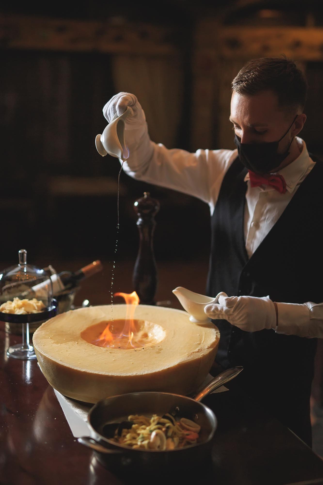 Chef at work preparing plated tasting menu in upscale kitchen